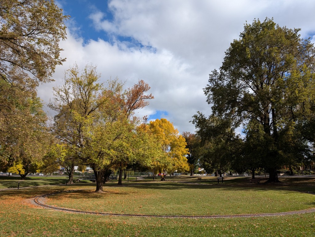 Matthews Park in Orange, NSW, showing the autumn colour of the leaves and the mini railroad track